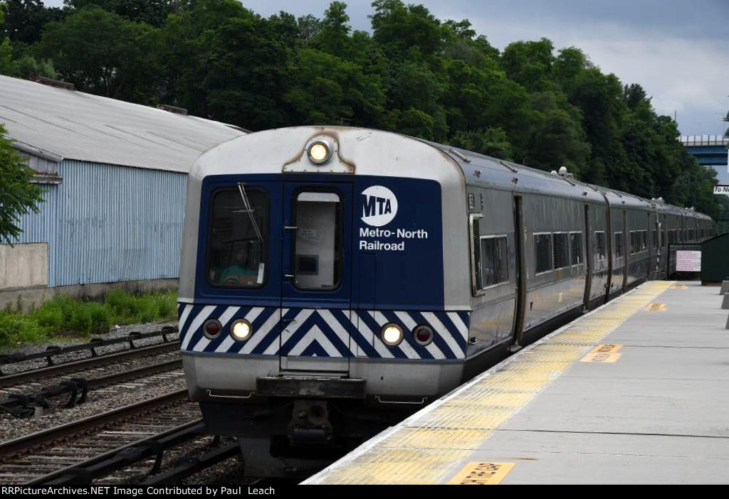 Outbound commuter approaches the station